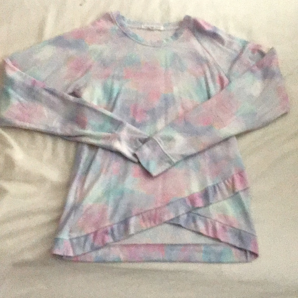 This is a long sleeve shirt/sweater with a splash of pastel colors